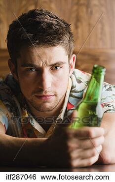 Stock Photo - depressed man 
holding beer. 
fotosearch - search 
stock photos, 
pictures, images, 
and photo clipart