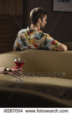 Stock Photo - woman holding 
drink by man in 
bar. fotosearch 
- search stock 
photos, pictures, 
images, and photo 
clipart