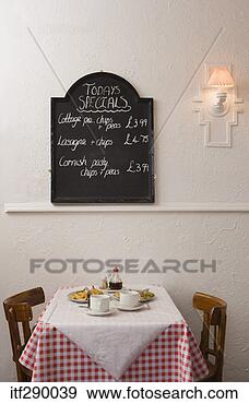 Stock Photograph - menu and table 
in british cafe. 
fotosearch - search 
stock photos, 
pictures, images, 
and photo clipart