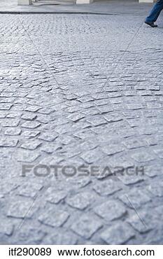 Stock Photograph - person walking 
on cobblestone 
street. fotosearch 
- search stock 
photos, pictures, 
images, and photo 
clipart