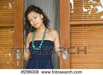 Stock Photo - woman standing 
in a doorway. 
fotosearch - search 
stock photos, 
pictures, images, 
and photo clipart