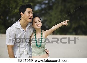 Stock Photograph - couple on a beach. 
fotosearch - search 
stock photos, 
pictures, images, 
and photo clipart