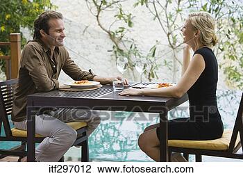Stock Photo - couple dining 
outdoors. fotosearch 
- search stock 
photos, pictures, 
images, and photo 
clipart