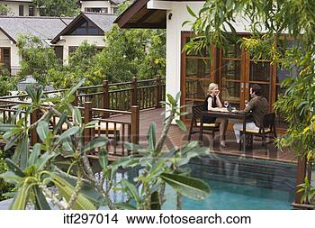 Stock Photo - couple dining 
outdoors. fotosearch 
- search stock 
photos, pictures, 
images, and photo 
clipart
