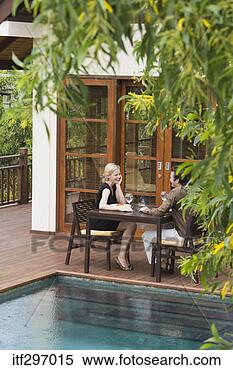 Stock Image - couple dining 
outdoors. fotosearch 
- search stock 
photos, pictures, 
images, and photo 
clipart