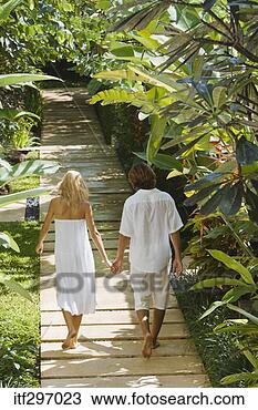 Stock Photo - couple on a garden 
walkway. fotosearch 
- search stock 
photos, pictures, 
images, and photo 
clipart