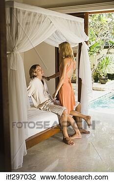 Stock Photo - couple lounging 
in a bedroom. 
fotosearch - search 
stock photos, 
pictures, images, 
and photo clipart