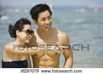Stock Photograph - couple by an ocean. 
fotosearch - search 
stock photos, 
pictures, images, 
and photo clipart