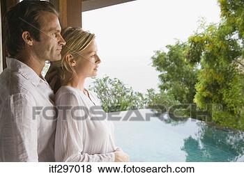 Stock Photo - couple by a window. 
fotosearch - search 
stock photos, 
pictures, images, 
and photo clipart