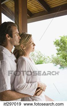 Stock Photograph - couple by a window. 
fotosearch - search 
stock photos, 
pictures, images, 
and photo clipart