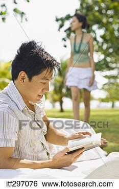 Stock Photo - man reading outdoors. 
fotosearch - search 
stock photos, 
pictures, images, 
and photo clipart