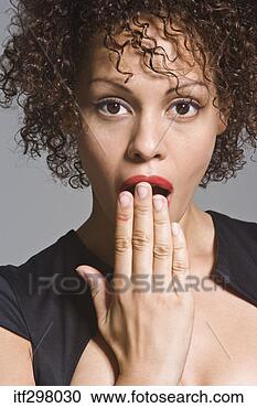 Stock Photography - woman covering 
her mouth in surprise. 
fotosearch - search 
stock photos, 
pictures, images, 
and photo clipart