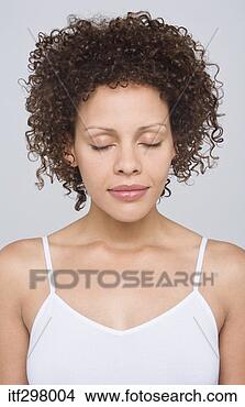 Stock Photo - woman with eyes 
shut. fotosearch 
- search stock 
photos, pictures, 
images, and photo 
clipart