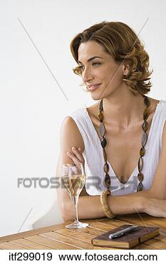 Stock Photograph - contemplative 
woman with wine 
glass. fotosearch 
- search stock 
photos, pictures, 
images, and photo 
clipart