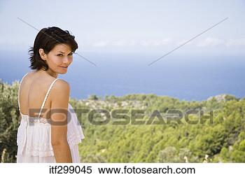 Stock Image - smiling woman 
with picturesque 
landscape. fotosearch 
- search stock 
photos, pictures, 
images, and photo 
clipart