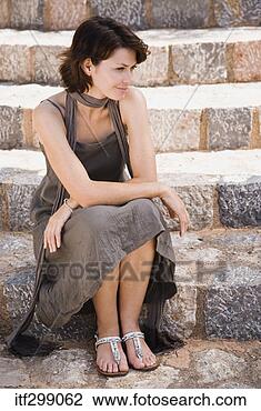 Stock Photo - woman sitting 
on step. fotosearch 
- search stock 
photos, pictures, 
images, and photo 
clipart