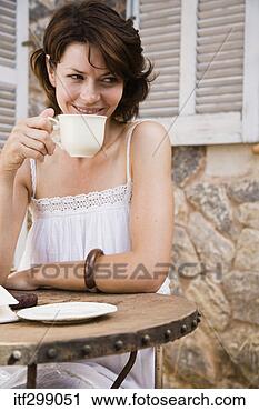 Stock Photography - woman sitting 
at table. fotosearch 
- search stock 
photos, pictures, 
images, and photo 
clipart