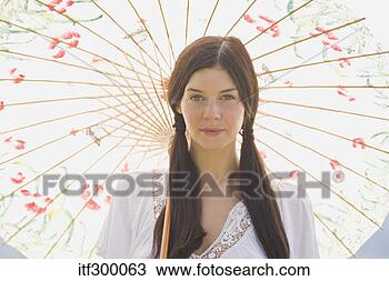 Stock Photo - woman holding 
parasol. fotosearch 
- search stock 
photos, pictures, 
images, and photo 
clipart