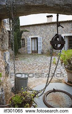 Stock Image - chain and bucket 
over a well. fotosearch 
- search stock 
photos, pictures, 
images, and photo 
clipart