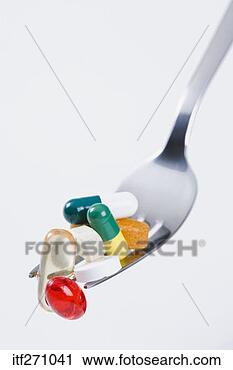 Stock Photography - pills stuck in 
fork. fotosearch 
- search stock 
photos, pictures, 
images, and photo 
clipart
