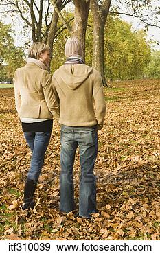 Stock Photograph - couple in autumn 
leaves. fotosearch 
- search stock 
photos, pictures, 
images, and photo 
clipart