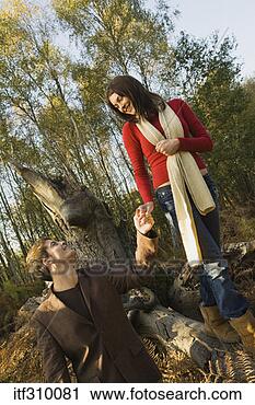 Stock Photography - couple walking 
in woods. fotosearch 
- search stock 
photos, pictures, 
images, and photo 
clipart