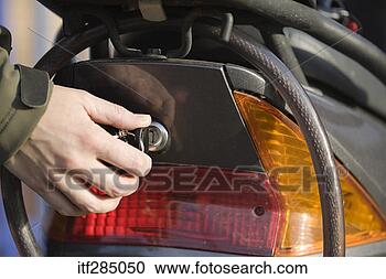Stock Photography - locking compartment 
on scooter. fotosearch 
- search stock 
photos, pictures, 
images, and photo 
clipart