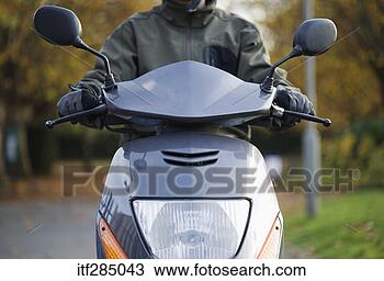 Stock Photo - riding a motorized 
scooter. fotosearch 
- search stock 
photos, pictures, 
images, and photo 
clipart