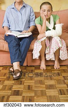 Stock Photo - bored injured 
girl with mother. 
fotosearch - search 
stock photos, 
pictures, images, 
and photo clipart