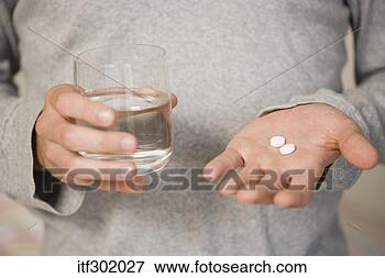 Picture - hands holding 
medicine and water. 
fotosearch - search 
stock photos, 
pictures, images, 
and photo clipart