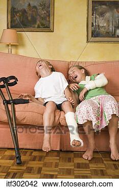 Stock Photo - injured children 
laughing on couch. 
fotosearch - search 
stock photos, 
pictures, images, 
and photo clipart