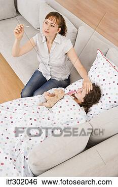 Stock Photo - mother taking 
sick daughters 
temperature. fotosearch 
- search stock 
photos, pictures, 
images, and photo 
clipart