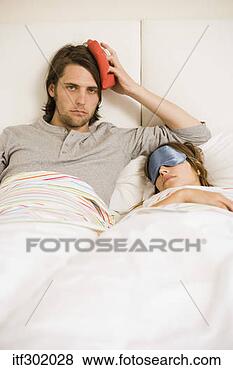 Stock Photo - sick couple resting 
in bed. fotosearch 
- search stock 
photos, pictures, 
images, and photo 
clipart