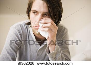 Stock Photo - sick man wiping 
nose with tissue. 
fotosearch - search 
stock photos, 
pictures, images, 
and photo clipart