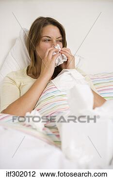 Stock Photo - sick woman blowing 
nose. fotosearch 
- search stock 
photos, pictures, 
images, and photo 
clipart