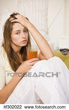 Stock Photo - sick woman holding 
drink. fotosearch 
- search stock 
photos, pictures, 
images, and photo 
clipart