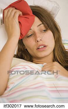 Picture - sick woman with 
ice pack. fotosearch 
- search stock 
photos, pictures, 
images, and photo 
clipart