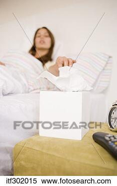 Stock Image - sick woman reaching 
for tissue. fotosearch 
- search stock 
photos, pictures, 
images, and photo 
clipart