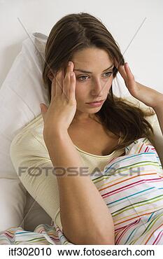 Stock Photography - woman with migraine. 
fotosearch - search 
stock photos, 
pictures, images, 
and photo clipart