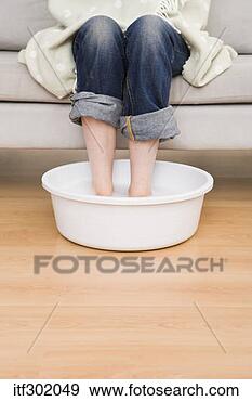 Stock Photograph - woman soaking 
feet. fotosearch 
- search stock 
photos, pictures, 
images, and photo 
clipart