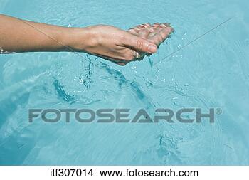 Stock Photo - hand cupping water. 
fotosearch - search 
stock photos, 
pictures, images, 
and photo clipart