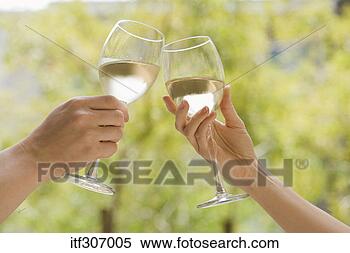 Stock Image - hands toasting 
glasses of wine. 
fotosearch - search 
stock photos, 
pictures, images, 
and photo clipart