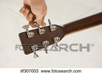 Banco de Imagem - mão,  ajustar, 
 guitarra. fotosearch 
- busca de fotos, 
imagens e clipart