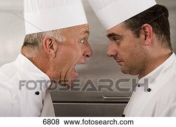 Stock Photo - angry senior chef 
yelling at junior 
chef in commercial 
kitchen,  face. 
fotosearch - search 
stock photos, 
pictures, images, 
and photo clipart