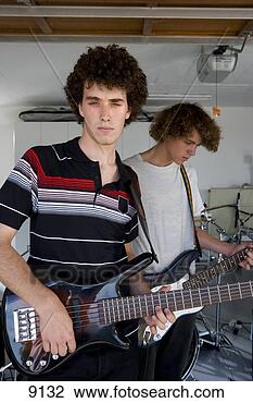Stock Photo - two teenage boys 
(15-17) playing 
electric guitar, 
 portrait of boy 
in. fotosearch 
- search stock 
photos, pictures, 
images, and photo 
clipart