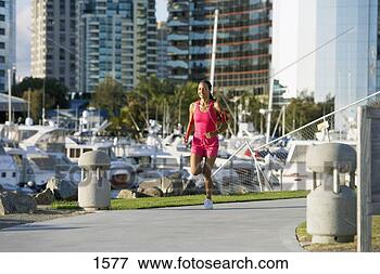 Picture - usa,  california, 
 san diego,  woman 
wearing pink sports 
vest and. fotosearch 
- search stock 
photos, pictures, 
images, and photo 
clipart