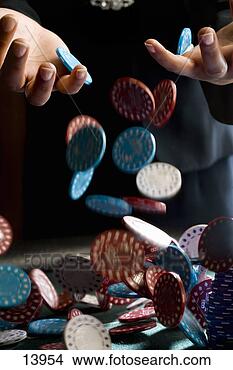 Stock Photo - woman dropping 
gambling chips 
on table, close-up 
of chips falling. 
fotosearch - search 
stock photos, 
pictures, images, 
and photo clipart