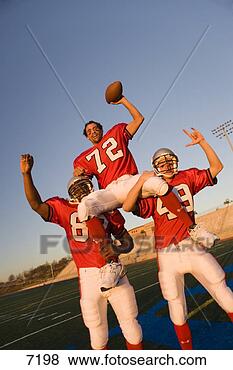 Stock Photo - american football 
players,  in red 
football strips, 
 celebrating. 
fotosearch - search 
stock photos, 
pictures, images, 
and photo clipart