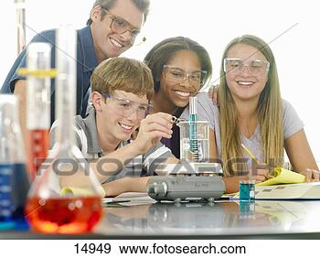 Stock Photograph - school students 
(12-14) and teacher 
with experiment 
in science class. 
fotosearch - search 
stock photos, 
pictures, images, 
and photo clipart