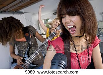 Stock Photograph - three teenage 
girls (15-17) 
in garage band, 
 teenage girl 
singing in. fotosearch 
- search stock 
photos, pictures, 
images, and photo 
clipart